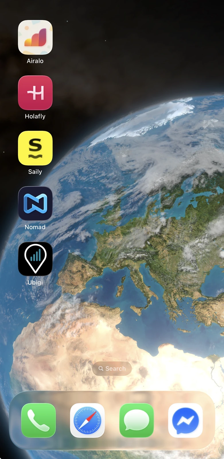 iPhone home screen with Airalo, Holafly, Saily, Nomad and Ubigi eSIM apps installed